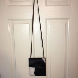 Cow hair on hide purse